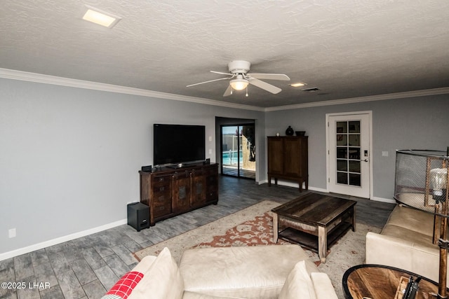 living room with ceiling fan, wood-type flooring, and a textured ceiling