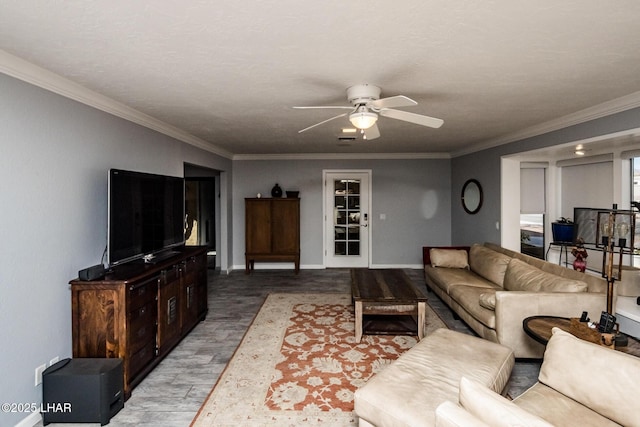 living room with ceiling fan, light wood-type flooring, and crown molding