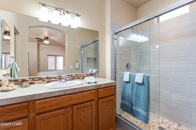 406 Noland Ct, Lake Havasu City, AZ 86403 - full bath featuring ceiling fan, a shower stall, vanity, and backsplash