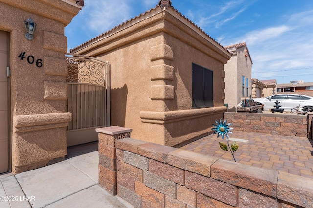 406 Noland Ct, Lake Havasu City, AZ 86403 - view of side of property featuring a tile roof and stucco siding