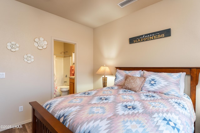406 Noland Ct, Lake Havasu City, AZ 86403 - bedroom with wood finished floors, baseboards, and ensuite bathroom