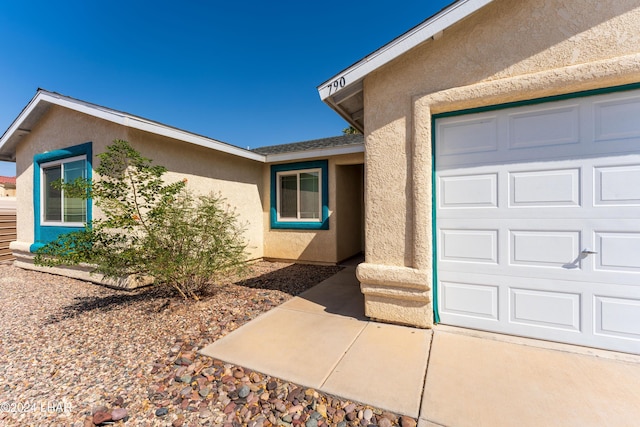 doorway to property featuring a garage