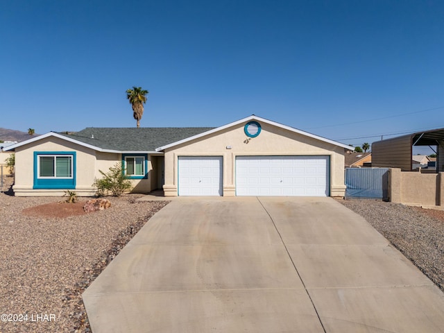 ranch-style house featuring a garage