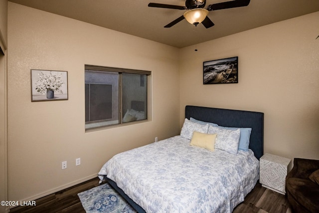 bedroom with ceiling fan and dark hardwood / wood-style floors