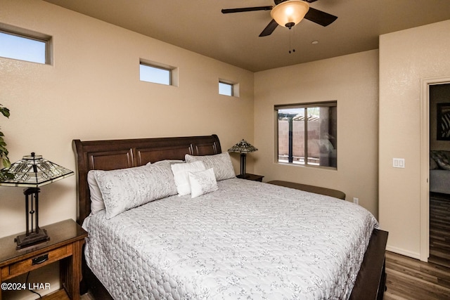 bedroom featuring dark wood-type flooring and ceiling fan