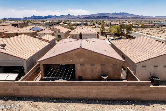 birds eye view of property featuring a mountain view