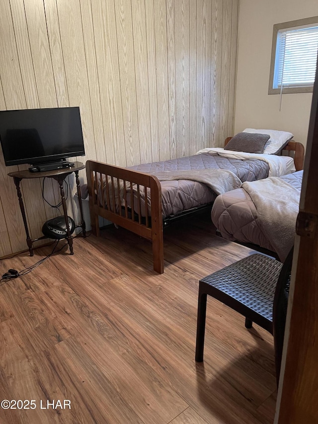 7681 E Robin Hood Rd, Williams, AZ 86046 - bedroom featuring wood finished floors and wooden walls