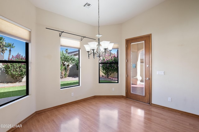 2620 Via Palma, Lake Havasu City, AZ 86406 - unfurnished room featuring wood finished floors and a chandelier