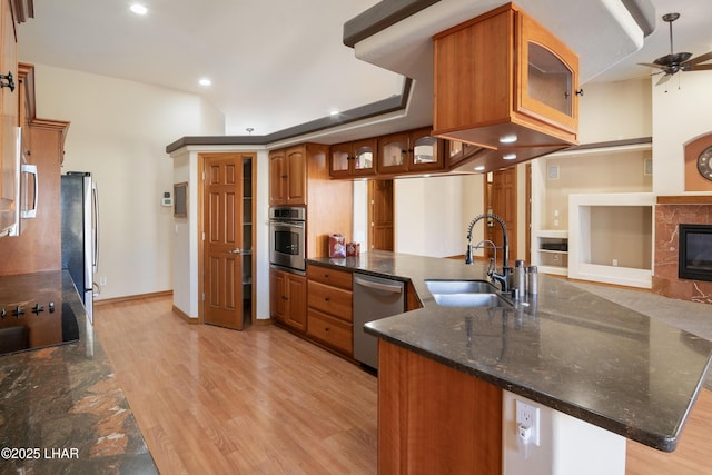 2620 Via Palma, Lake Havasu City, AZ 86406 - kitchen with stainless steel appliances, brown cabinets, light wood-type flooring, a ceiling fan, and recessed lighting