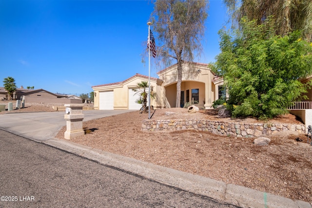 2620 Via Palma, Lake Havasu City, AZ 86406 - mediterranean / spanish house featuring driveway, stucco siding, and an attached garage