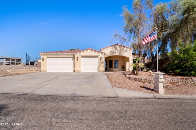 2620 Via Palma, Lake Havasu City, AZ 86406 - mediterranean / spanish home with stucco siding, a garage, a tiled roof, and concrete driveway