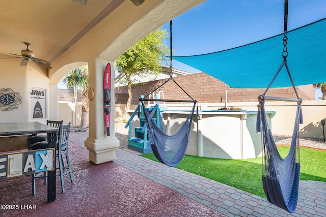 2620 Via Palma, Lake Havasu City, AZ 86406 - fenced backyard featuring a patio, a ceiling fan, and outdoor dining space