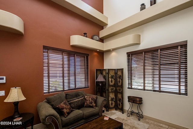 living room with a towering ceiling