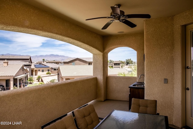 balcony with a mountain view and sink