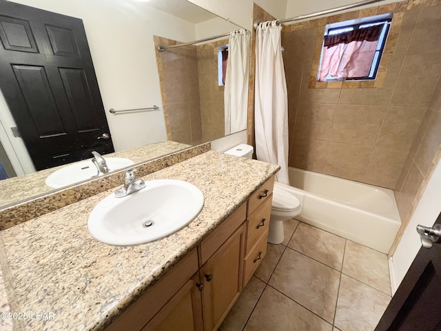 full bath with shower / bath combo with shower curtain, vanity, toilet, and tile patterned floors