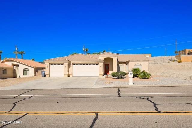 mediterranean / spanish-style house featuring a garage