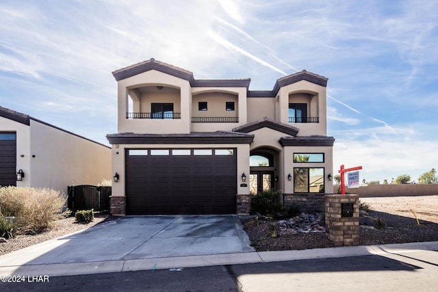 view of front of property with a garage and a balcony