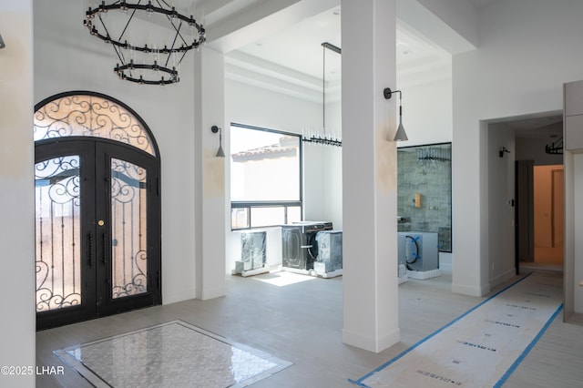 6724 Corte De Los Bueyes, Lake Havasu City, AZ 86404 - entryway featuring a chandelier, a high ceiling, french doors, and wood finished floors