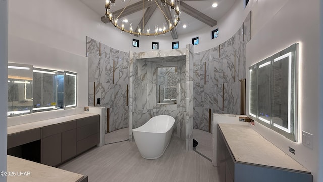 6724 Corte De Los Bueyes, Lake Havasu City, AZ 86404 - bathroom with a freestanding bath, vanity, a chandelier, beam ceiling, and a marble finish shower