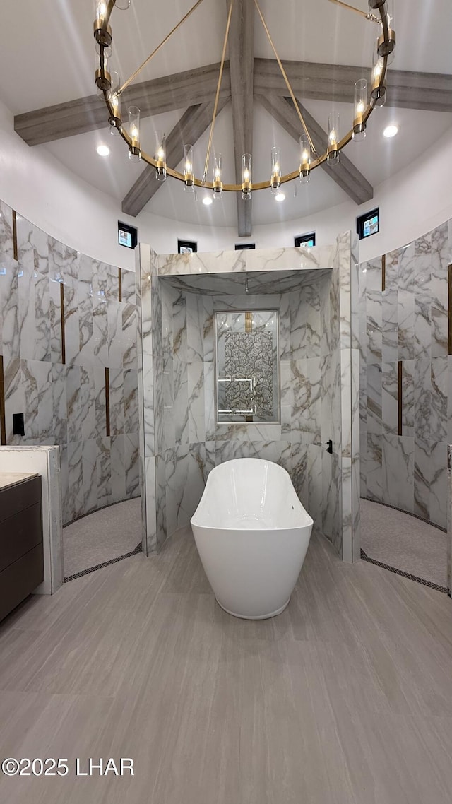 6724 Corte De Los Bueyes, Lake Havasu City, AZ 86404 - bathroom with tile walls, a chandelier, a marble finish shower, a freestanding bath, and vanity