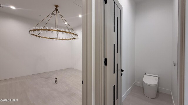 6724 Corte De Los Bueyes, Lake Havasu City, AZ 86404 - bathroom with wood finished floors and a chandelier
