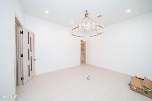 6724 Corte De Los Bueyes, Lake Havasu City, AZ 86404 - spare room featuring a chandelier, recessed lighting, and light wood-style floors