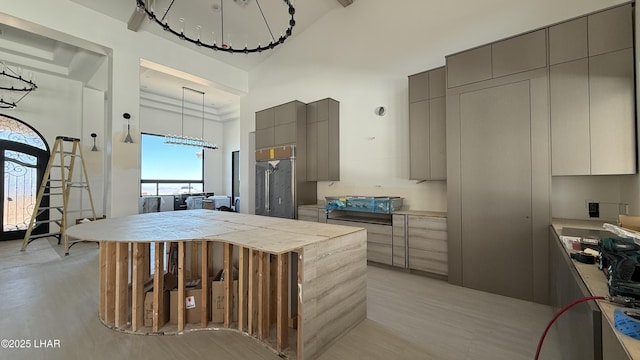 6724 Corte De Los Bueyes, Lake Havasu City, AZ 86404 - kitchen with gray cabinets, a high ceiling, modern cabinets, light countertops, and high end refrigerator