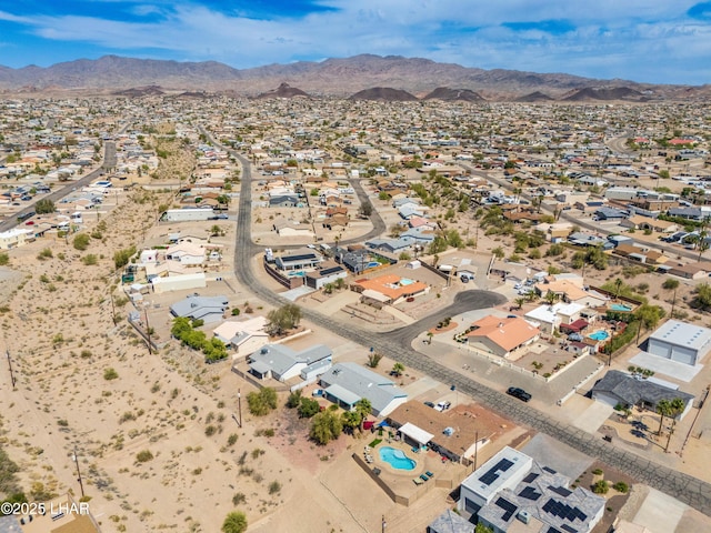 drone / aerial view featuring a residential view and a mountain view