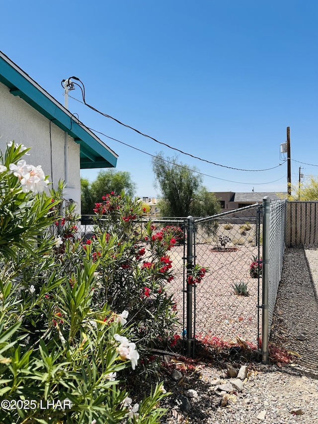 view of gate with fence