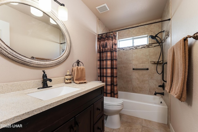 full bathroom featuring tile patterned flooring, visible vents, toilet, vanity, and shower / bath combo