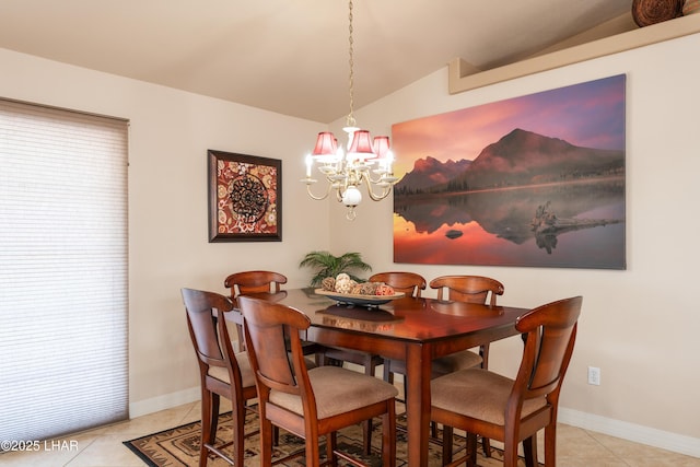 dining area featuring light tile patterned flooring, lofted ceiling, baseboards, and a notable chandelier