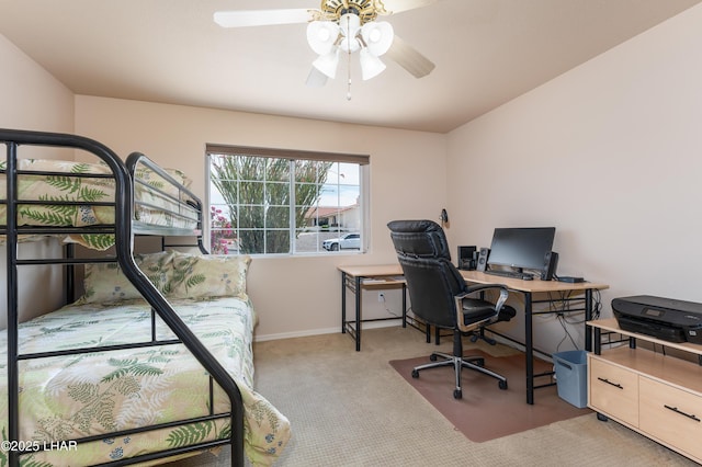 carpeted bedroom featuring baseboards and a ceiling fan