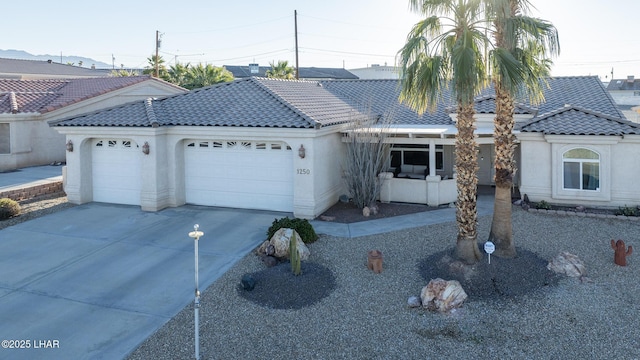 ranch-style home featuring a garage