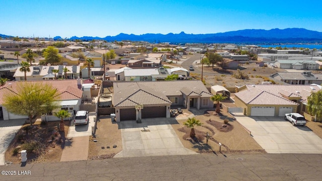 drone / aerial view with a mountain view and a residential view