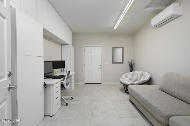 office space with light tile patterned flooring, a wall mounted AC, and baseboards