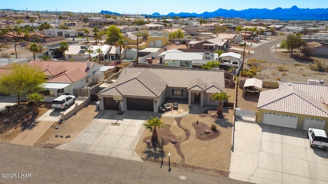 aerial view featuring a mountain view and a residential view