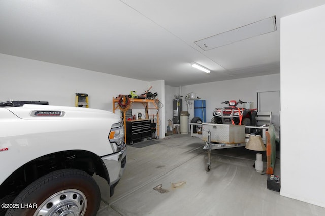 garage with refrigerator and water heater