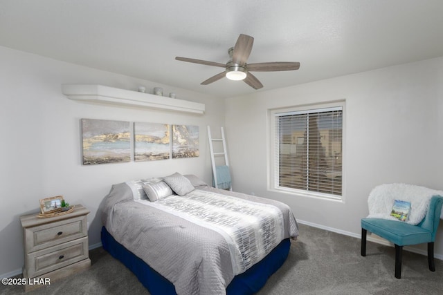 carpeted bedroom featuring baseboards and ceiling fan