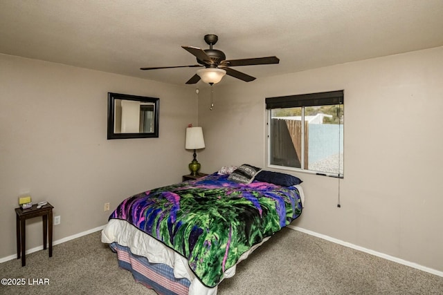 bedroom featuring carpet floors, baseboards, and a ceiling fan