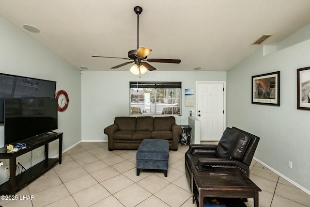 living room featuring a ceiling fan, visible vents, baseboards, and light tile patterned flooring