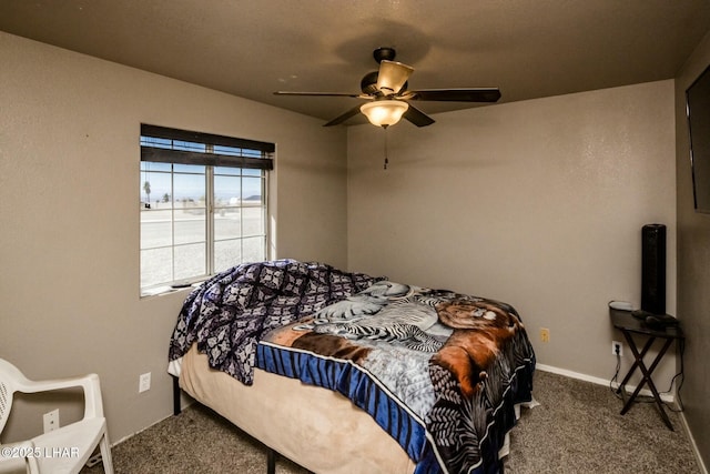 carpeted bedroom featuring a ceiling fan and baseboards