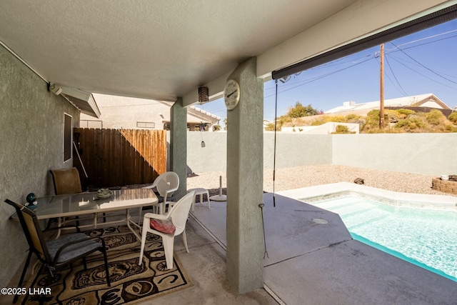 view of patio / terrace with outdoor dining space and a fenced backyard