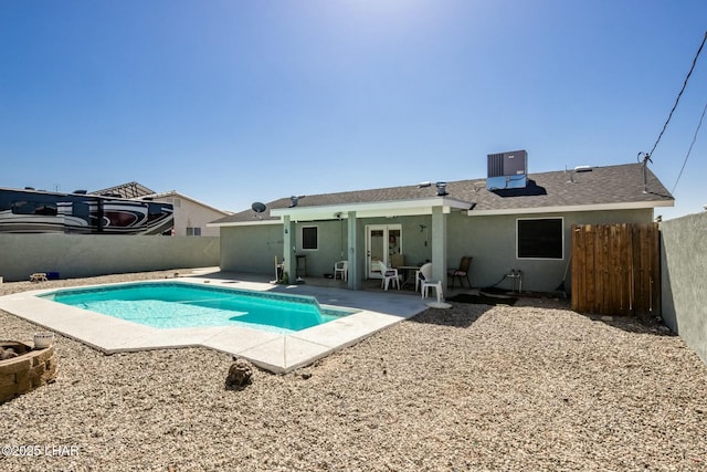 view of swimming pool with a fenced in pool, french doors, a fenced backyard, and a patio