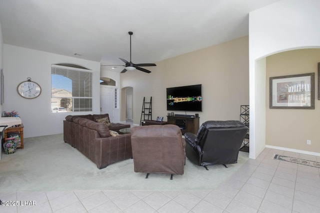 tiled living room featuring ceiling fan