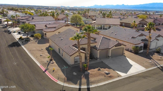 birds eye view of property with a mountain view