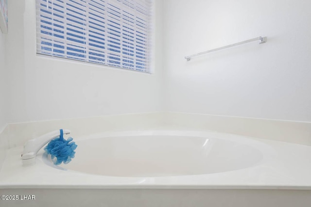 bathroom with a washtub
