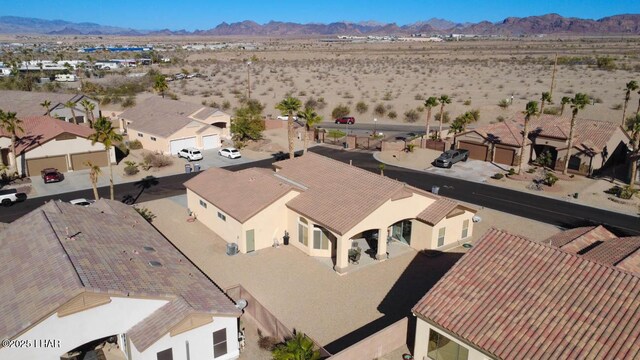 birds eye view of property with a mountain view