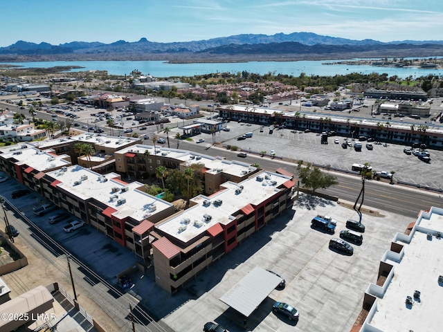 aerial view featuring a water and mountain view