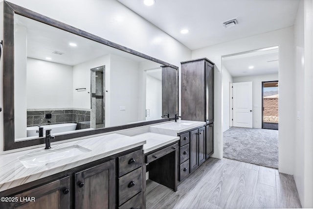 4801 N Diana Ave, Lake Havasu City, AZ 86404 - bathroom with double vanity, a soaking tub, and recessed lighting
