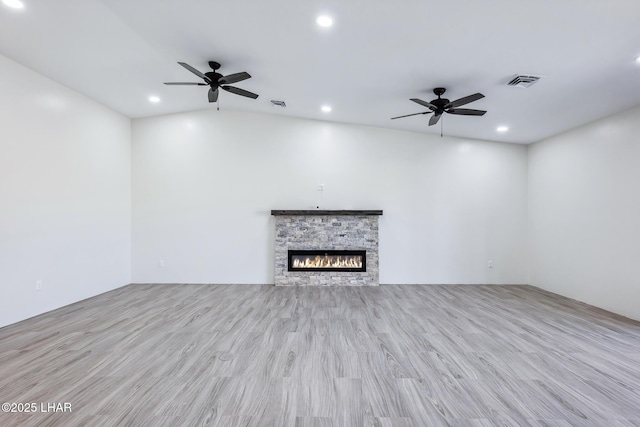 4801 N Diana Ave, Lake Havasu City, AZ 86404 - unfurnished living room with a ceiling fan, recessed lighting, wood finished floors, and a stone fireplace